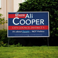 Corrugated plastic campaign yard sign on an H-stake in a lawn, 18x24